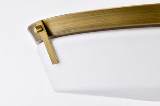Rowen Four Light Flush Mount in Natural Brass