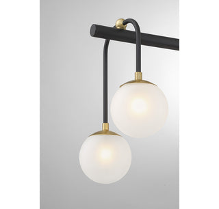 Couplet Eight Light Linear Chandelier in Matte Black with Warm Brass
